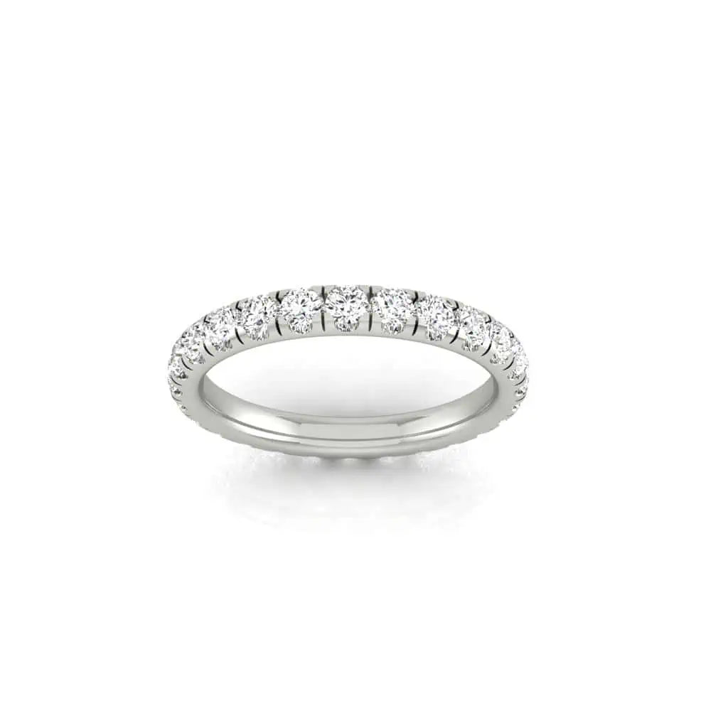 The 1ct Round Diamond Eternity Ring showcases small, round diamonds with VS Clarity set on a silver band against a plain white background.