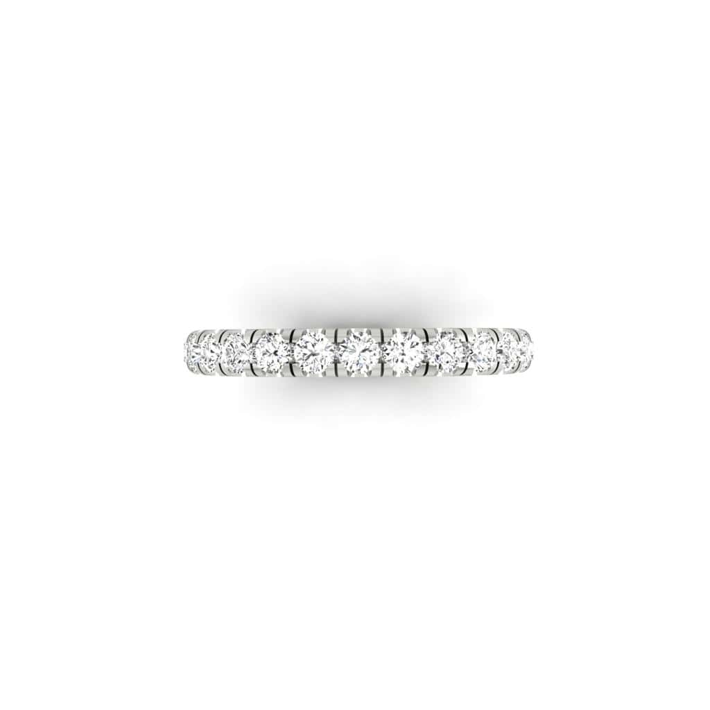 The 1ct Round Diamond Eternity Ring showcases simplicity and elegance, featuring a delicate silver band adorned with a continuous row of small, sparkling round diamonds of VS clarity, beautifully displayed against a plain white background.
