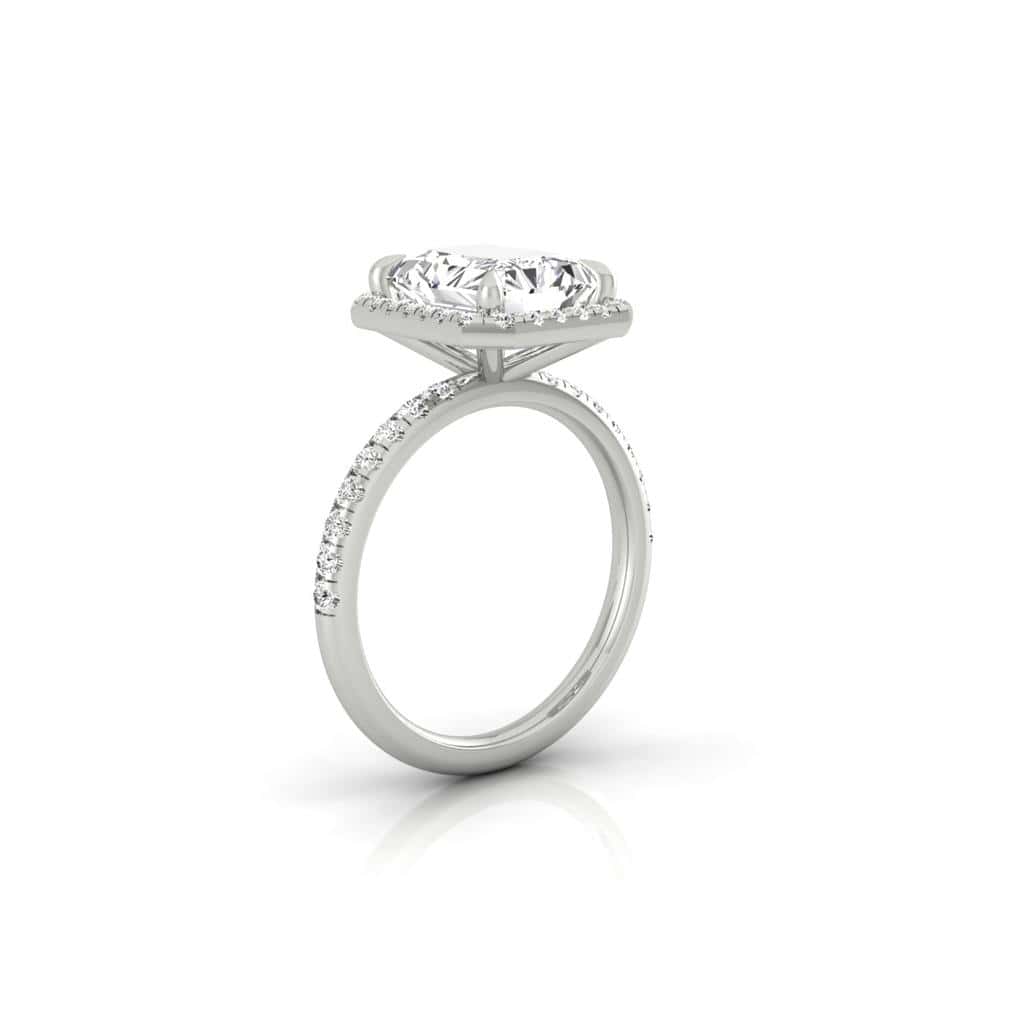 The Unity + Full Halo engagement ring from Janet Heller Fine Jewelry features a single prong-set center diamond on a U prong set pave diamond band and a full diamond halo.
The ring can be worn alone or stacked with your wedding band.