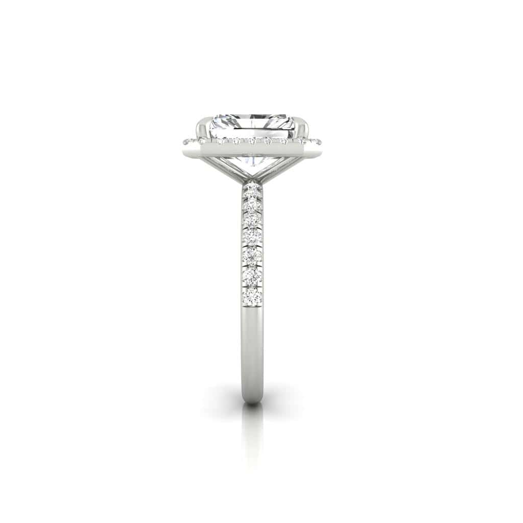 The Unity + Full Halo engagement ring from Janet Heller Fine Jewelry features a single prong-set center diamond on a U prong set pave diamond band and a full diamond halo.
The ring can be worn alone or stacked with your wedding band.