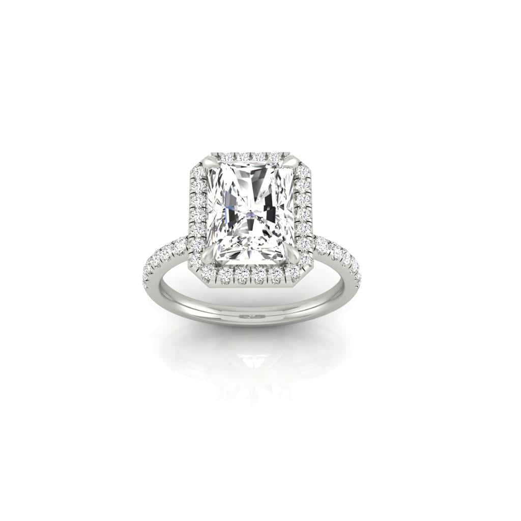 The Unity + Full Halo engagement ring from Janet Heller Fine Jewelry features a single prong-set center diamond on a U prong set pave diamond band and a full diamond halo.
The ring can be worn alone or stacked with your wedding band.