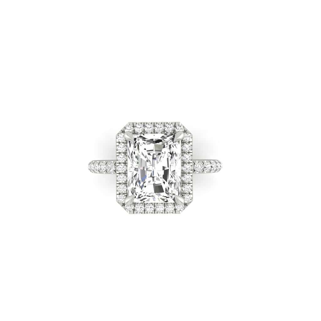 The Unity + Full Halo engagement ring from Janet Heller Fine Jewelry features a single prong-set center diamond on a U prong set pave diamond band and a full diamond halo.
The ring can be worn alone or stacked with your wedding band.
