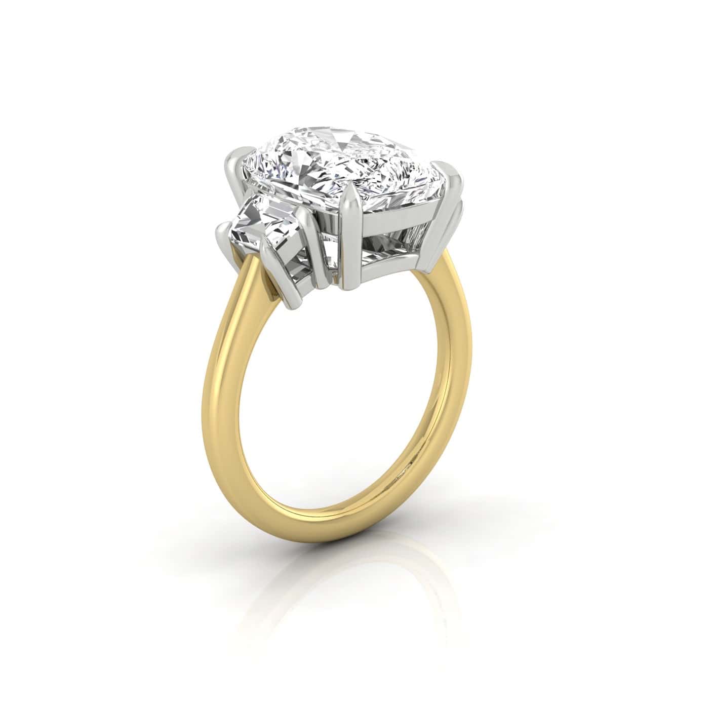 The Triad is an 18KT gold engagement ring showcasing a large, round diamond in a prong setting, complemented by sparkling diamond side stones. Its visible from the side and set against a white background, exuding timeless elegance from every angle.