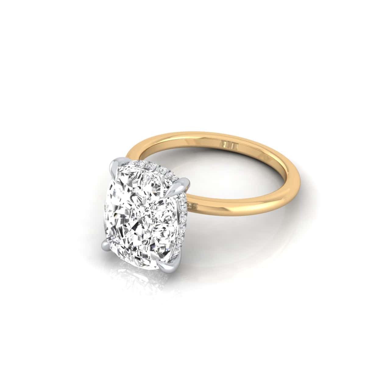 The Solitaire + Hidden Halo gold ring features an intricately faceted, square-cut diamond, set in silver prongs. Its polished band reveals a subtle hidden halo, accentuating the radiant centerpiece and brilliantly capturing light.