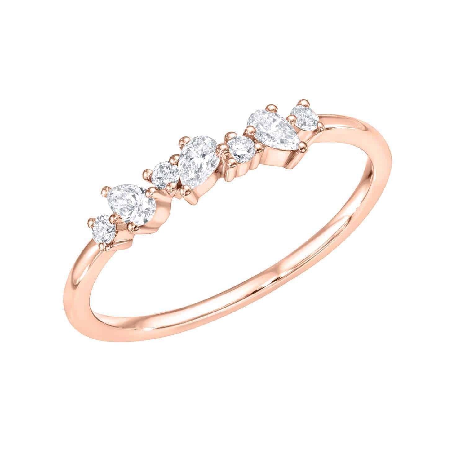 A delicate rose gold Mixed Cut Diamond Ring from Janet Heller’s fine jewelry collection, featuring seven white gemstones of various shapes set in a row along the band—available now as an exclusive preorder.