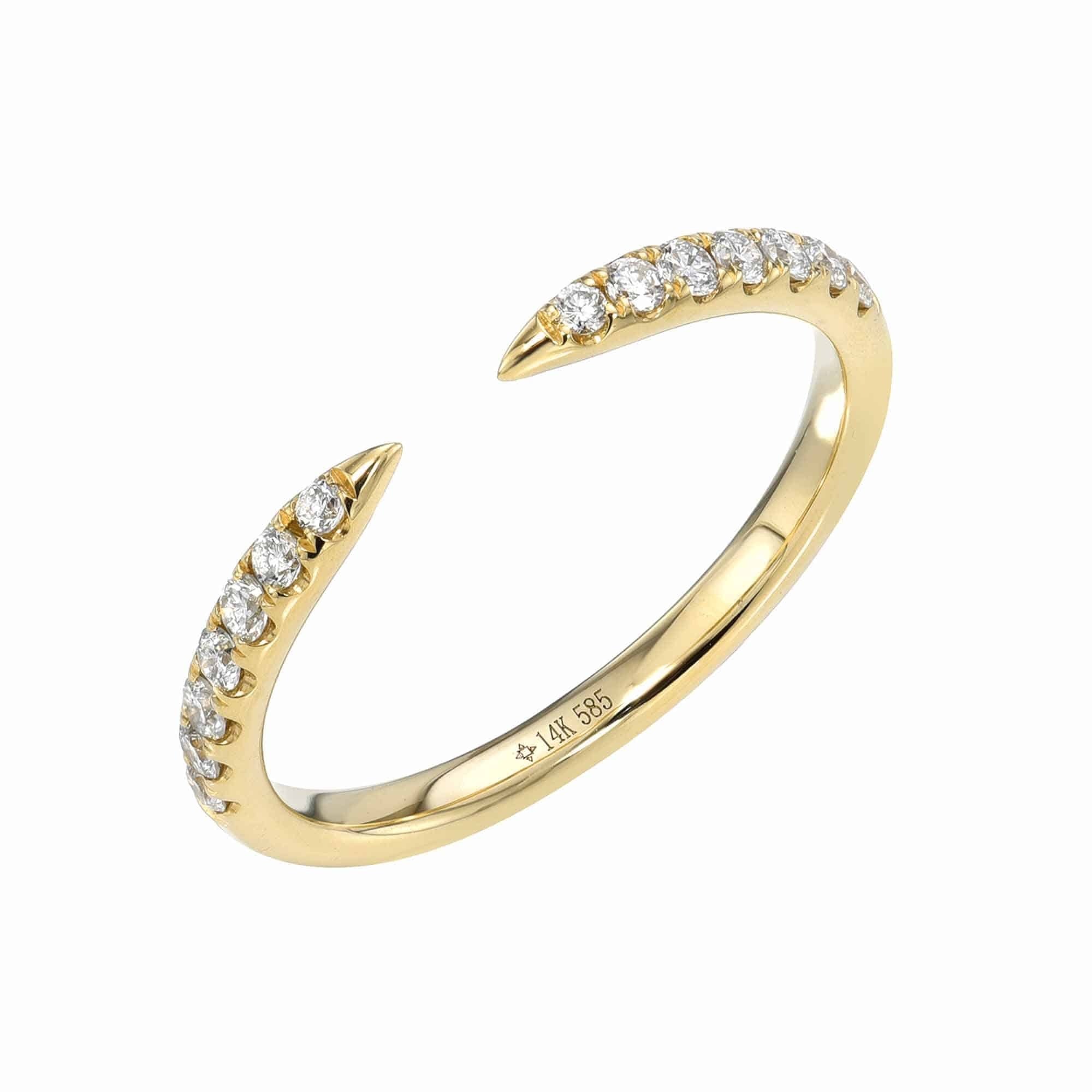 The Open Diamond Cuff Ring features a delicate open gold band with tapered, diamond-encrusted ends and an engraved “14k 585” inner band. This modern fine jewelry piece is available in your custom ring size.
