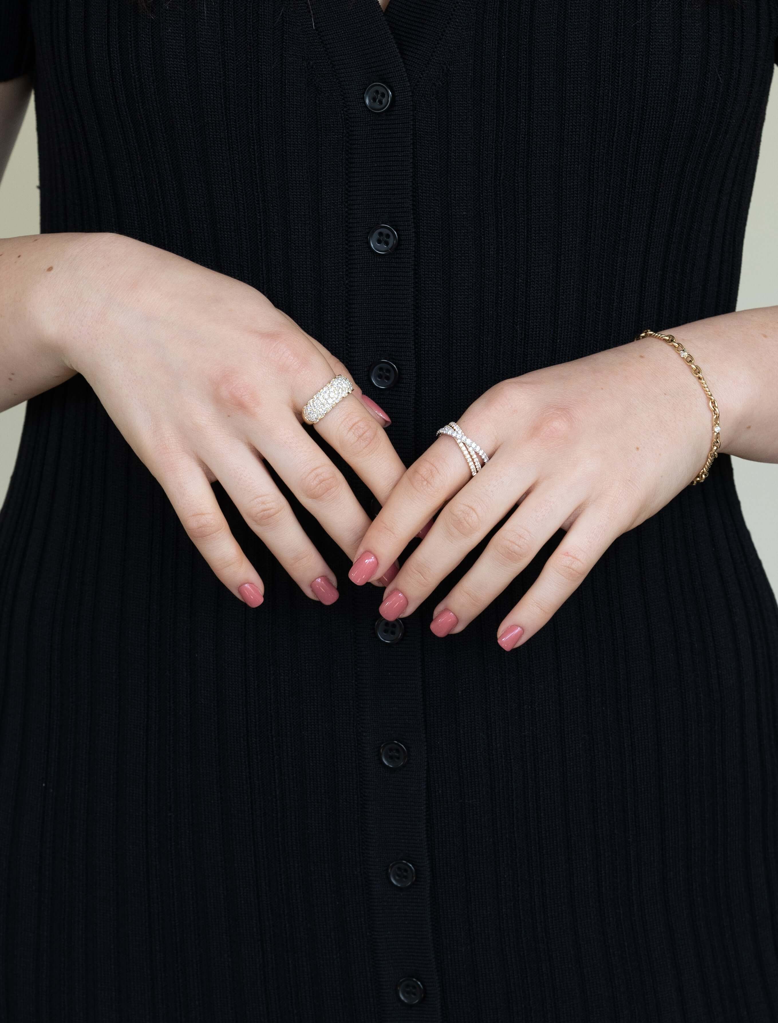 The Diamond Mosaic Ring from Janet Heller Fine Jewelry is crafted in 14KT gold.  The ring is encrusted with multiple diamonds in various sizes.  The band can be stacked or worn alone.