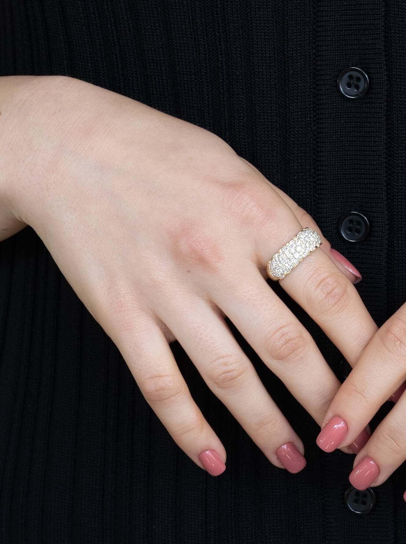 The Diamond Mosaic Ring from Janet Heller Fine Jewelry is crafted in 14KT gold.  The ring is encrusted with multiple diamonds in various sizes.  The band can be stacked or worn alone.