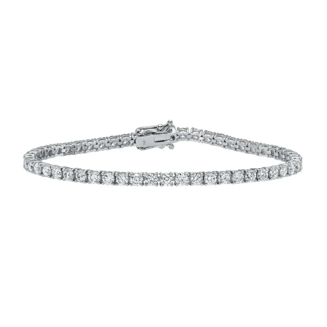 A 4ct Round Diamond Tennis Bracelet, crafted in silver with a single row of round-cut lab-grown diamonds and secured with a clasp, is displayed on a plain white background.