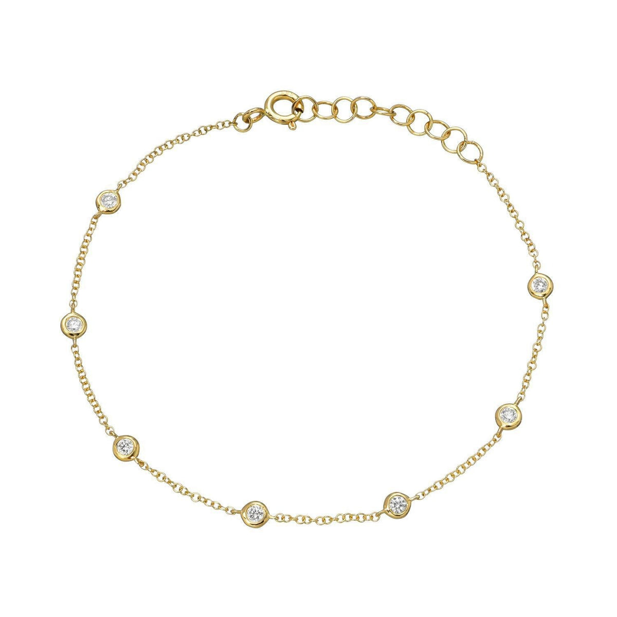 The Bezel Diamond Station Bracelet by Janet Heller Fine Jewelry features a delicate gold chain with seven evenly spaced round diamonds and an adjustable clasp.