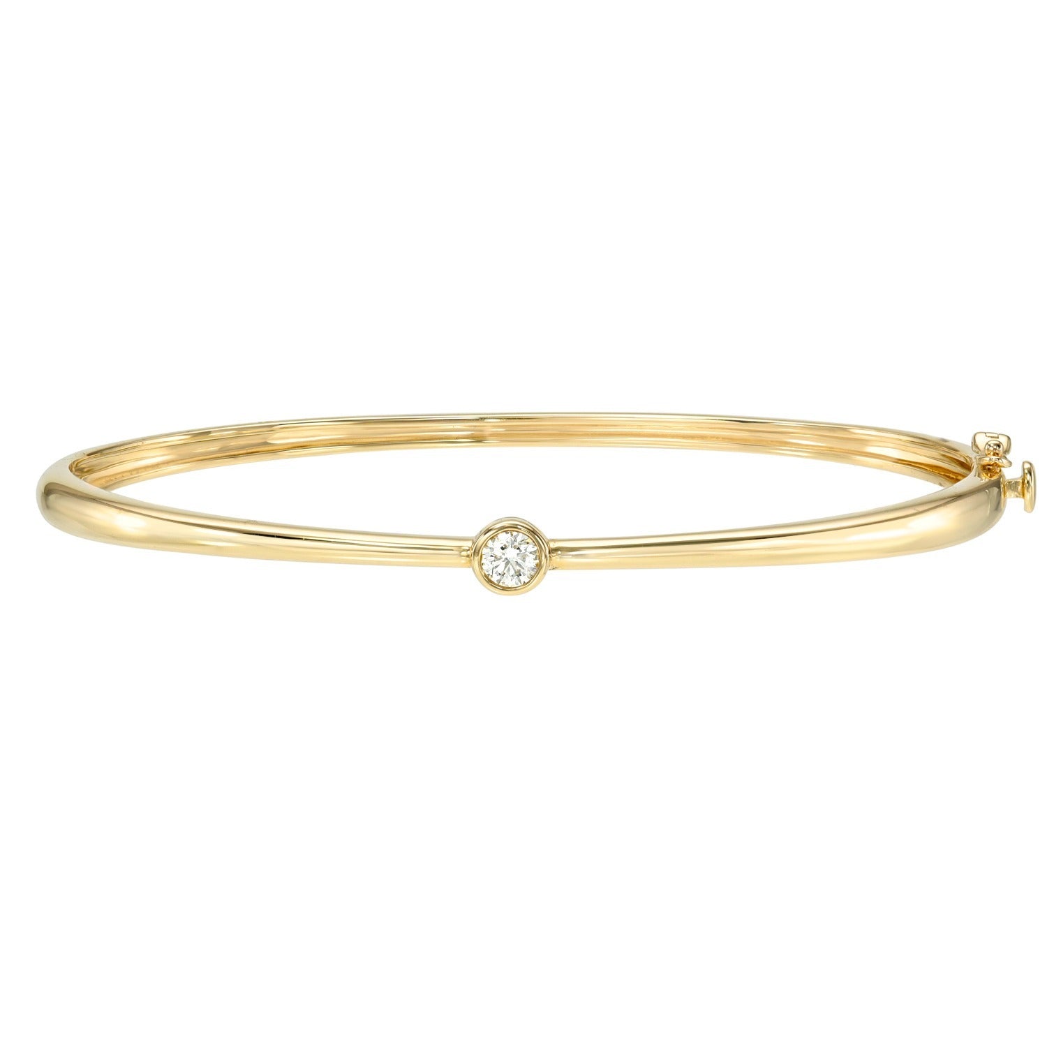 Introducing the Bezel Set Diamond Bangle—crafted in slender 14KT gold, this bracelet showcases a single bezel-set diamond at its center, displayed here against a white background for a classic and timeless presentation.