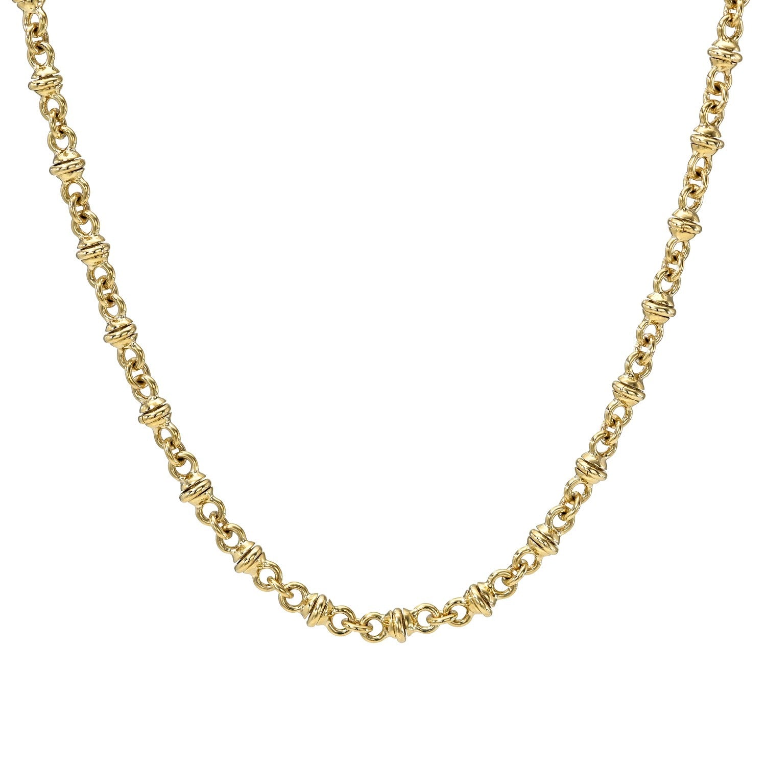 The Handmade Figure 8 Chain Necklace features small, twisted, knot-like links crafted from 14KT gold, forming a symmetrical figure 8 pattern and is elegantly displayed on a white background.