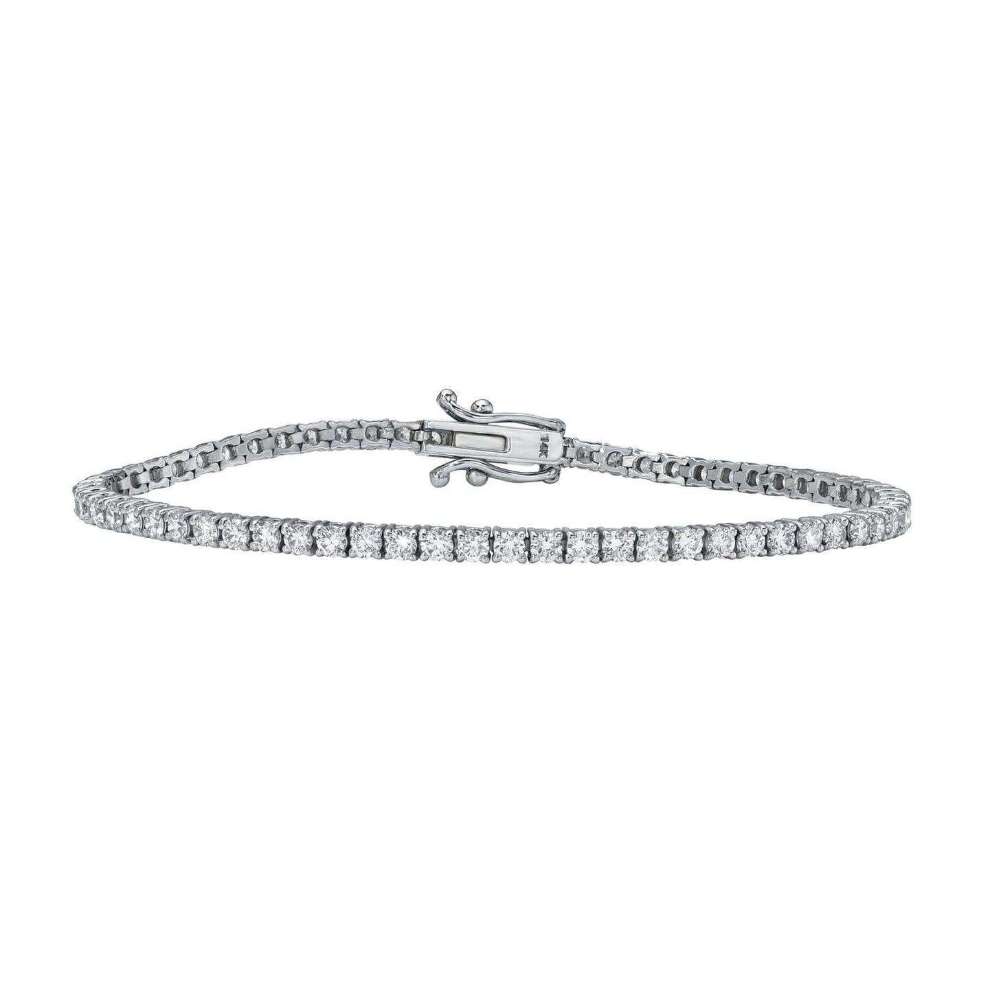 The 3ct Round Diamond Tennis Bracelet from Janet Heller Fine Jewelry is crafted in 14KT gold. The bracelet features  small diamonds in a continuous line and is available in both lab grown and natural diamonds.  The bracelet can be worn on its worn or layered with other bracelets.
