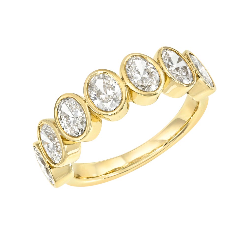 The Half Lab Oval Diamond Eternity Ring is crafted in 14KT gold and features seven bezel-set oval-shaped diamonds evenly spaced across the top of the band.
