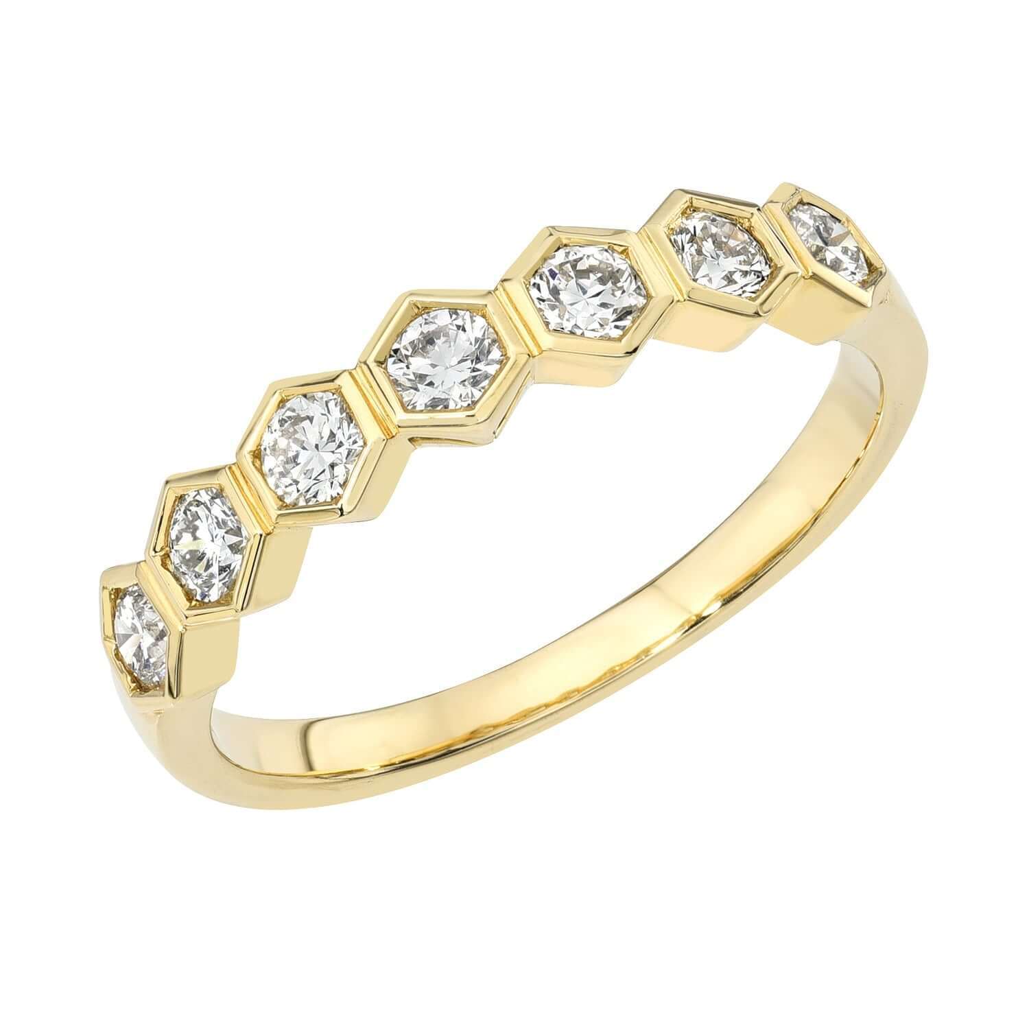 Diamond Honeycomb Stacking Ring—crafted in gold with seven hexagonal settings, each holding a round diamond. This exquisite piece by Janet Heller showcases a geometric, modern design that perfectly balances contemporary elegance with timeless craftsmanship. Available for preorder.
