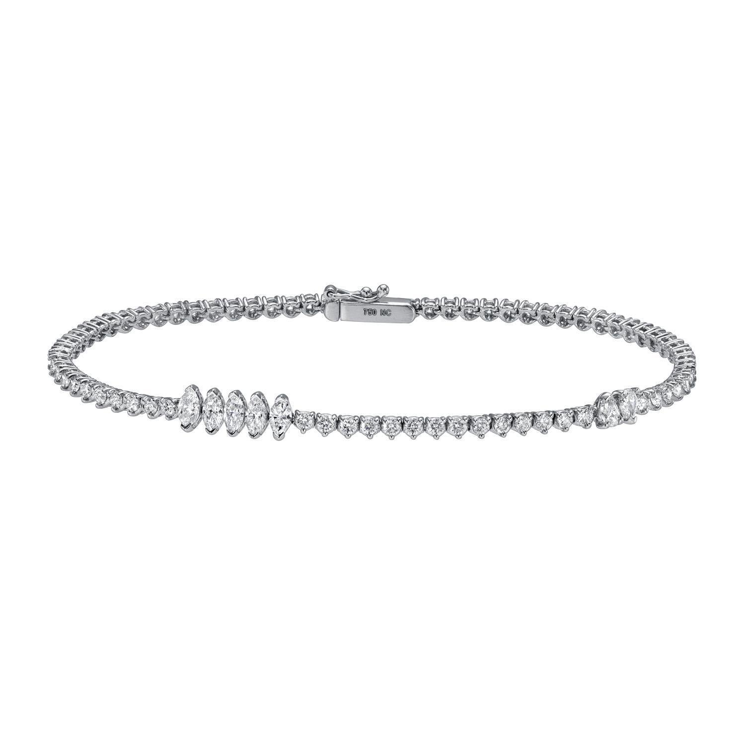 The Mixed Cut Diamond Tennis Bracelet by Janet Heller Fine Jewelry features round and marquise diamonds set in white metal with a secure clasp—a timeless and elegant accessory.