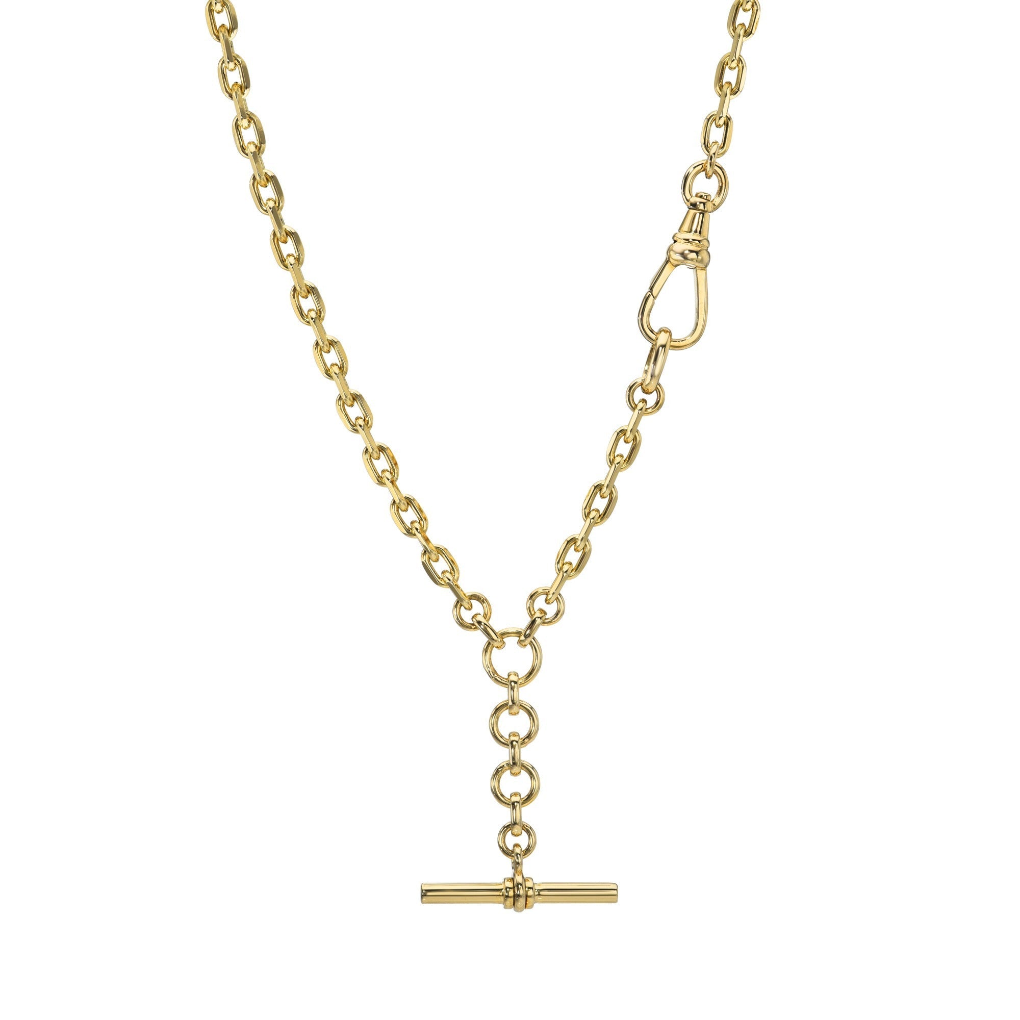 The Toggle Link Madrid Necklace features a polished gold chain with oval links, accented by a T-bar pendant and a distinctive side clasp. This piece from Janet Heller showcases custom jewelry at its finest—simple, elegant, and beautifully finished.