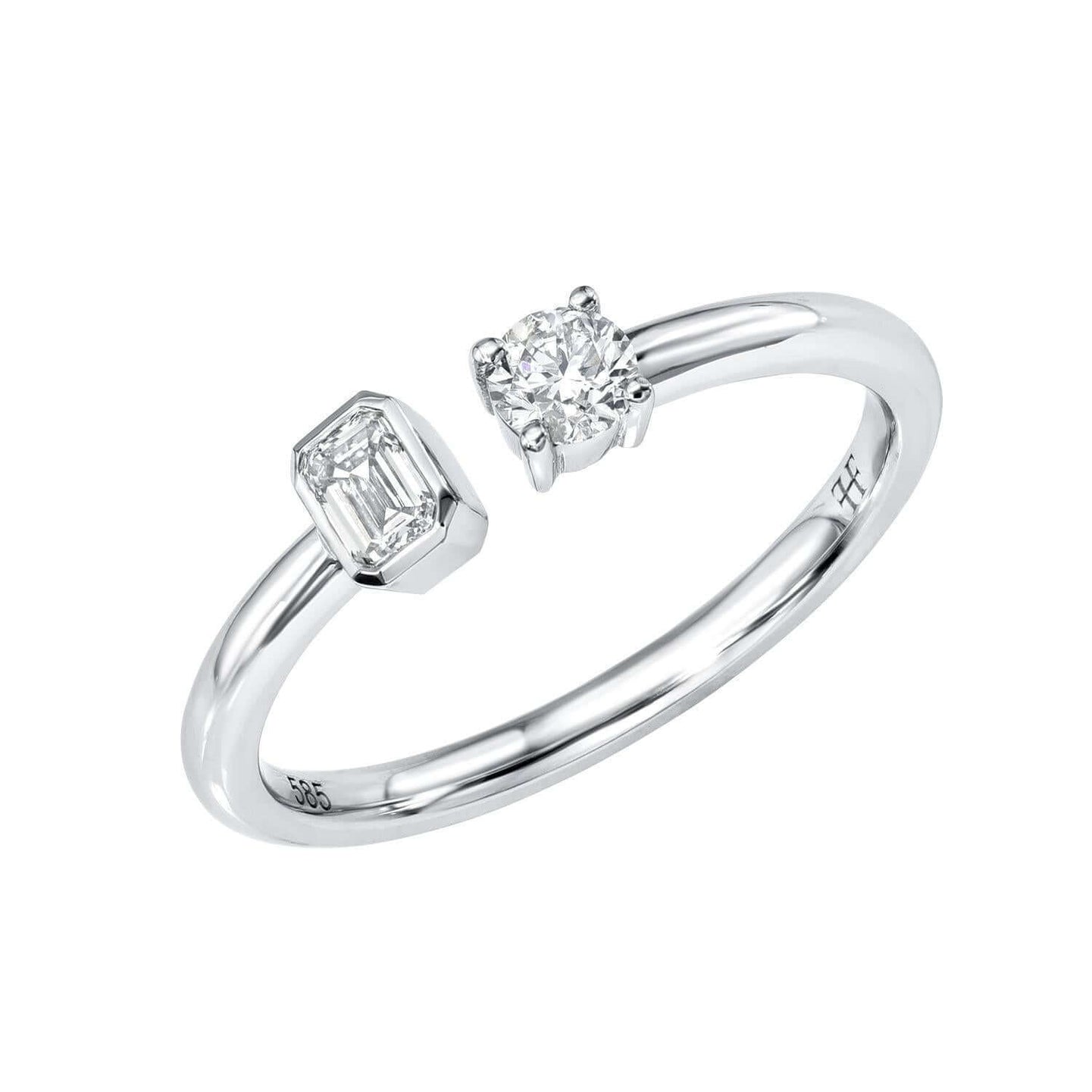 The Emerald & Round Toi Et Moi Ring from Janet Heller Fine Jewelry, is crafted in 14KT gold and features emerald and round-cut diamonds.  The emerald diamond is 0.15 carats in a bezel setting and the 0.15 carat round diamond is in a prong setting.  The ring can be stacked or worn on its own.