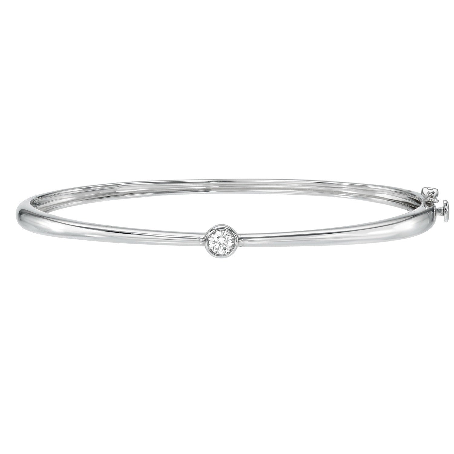 The Bezel Set Diamond Bangle showcases a minimalist silver design with a single round bezel set diamond at its center, finished with a sleek, polished shine—an elegant choice for those who appreciate fine jewelry.