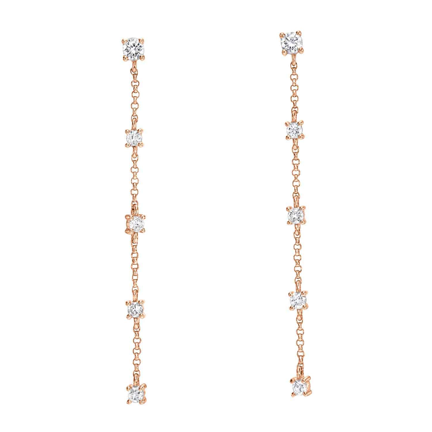 Discover the 5 Drop Diamond Finley Earrings—a pair of long, delicate gold chain drop earrings adorned with evenly spaced round white diamonds along the length, designed for pierced ears. These earrings showcase a simple, elegant, and minimalist style, making them a staple of fine jewelry.