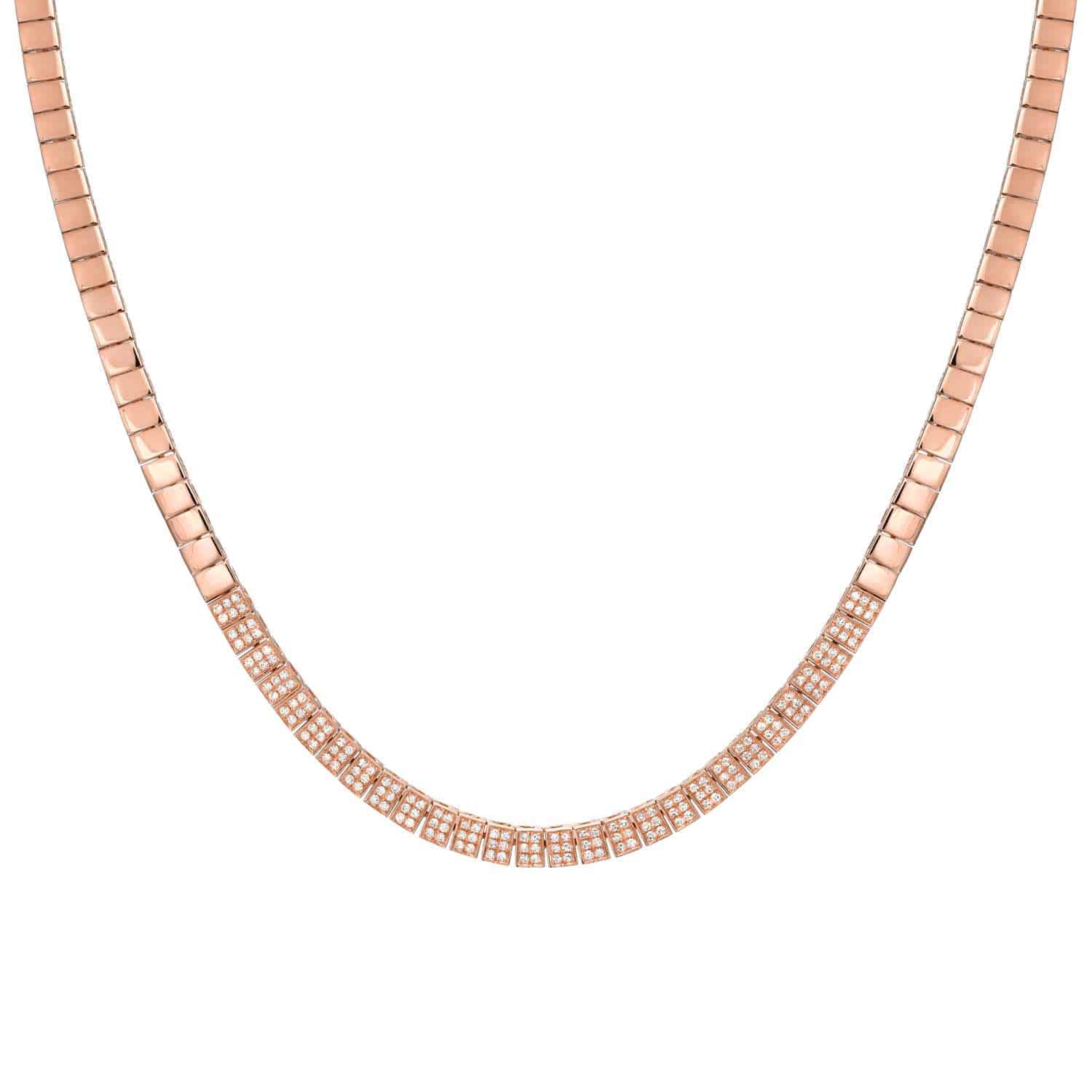 The Diamond Cubes Necklace from Janet Heller Fine Jewelry is an elegant rose gold piece with a herringbone pattern, highlighted by a section of small, shimmering diamonds along the front center. It is showcased against a plain white background.