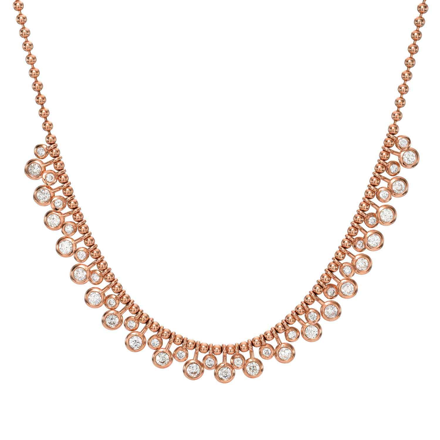 Introducing the Diamond Dangle Toilet Chain Necklace—a rose gold necklace featuring a delicate chain adorned with evenly spaced round white diamonds, each set in its own bezel for a symmetrical and elegant look. For custom jewelry or inquiries, please contact Janet Heller Fine Jewelry.