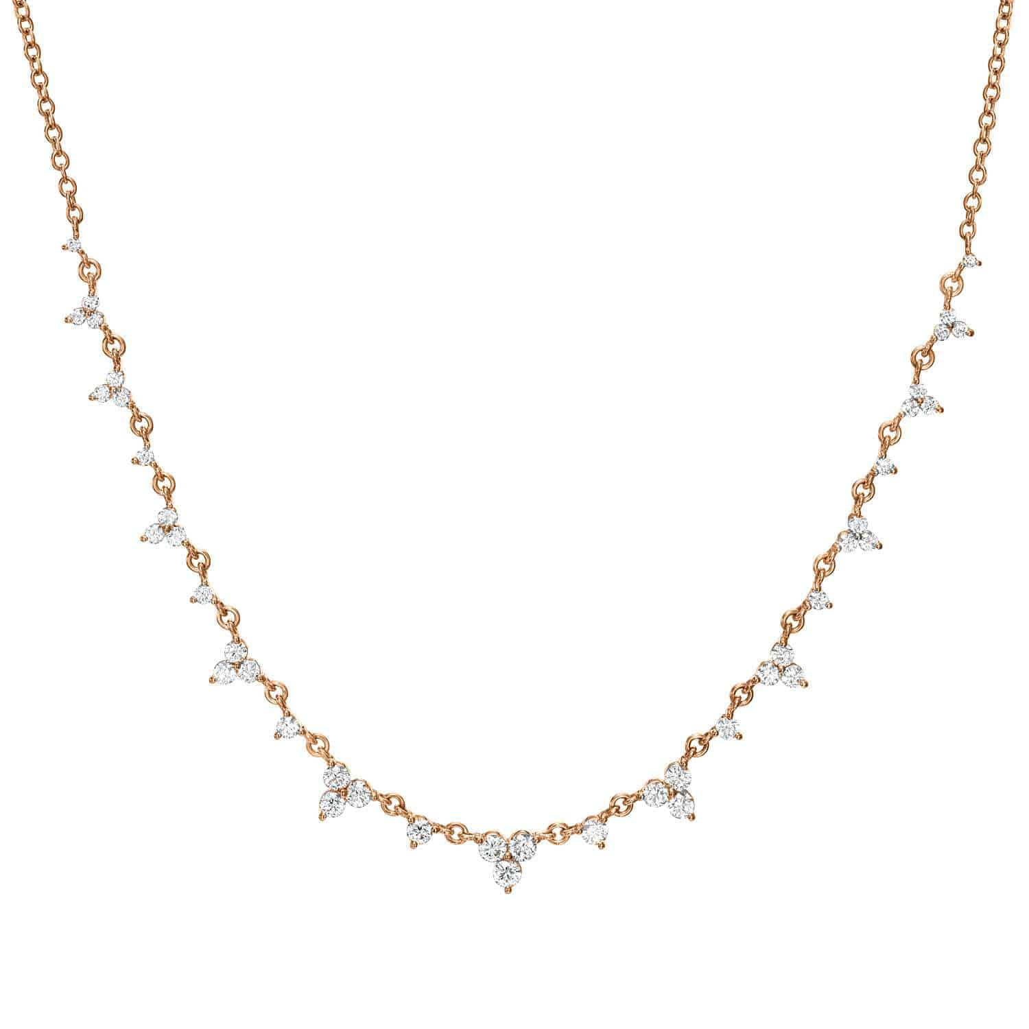 The Diamond Isabella Necklace from Janet Heller Fine Jewelry features a delicate rose gold chain adorned with evenly spaced small diamond clusters in a symmetrical design, beautifully displayed on a white background—an exquisite choice for those seeking elegant fine jewelry and personalized jewelry customizations.