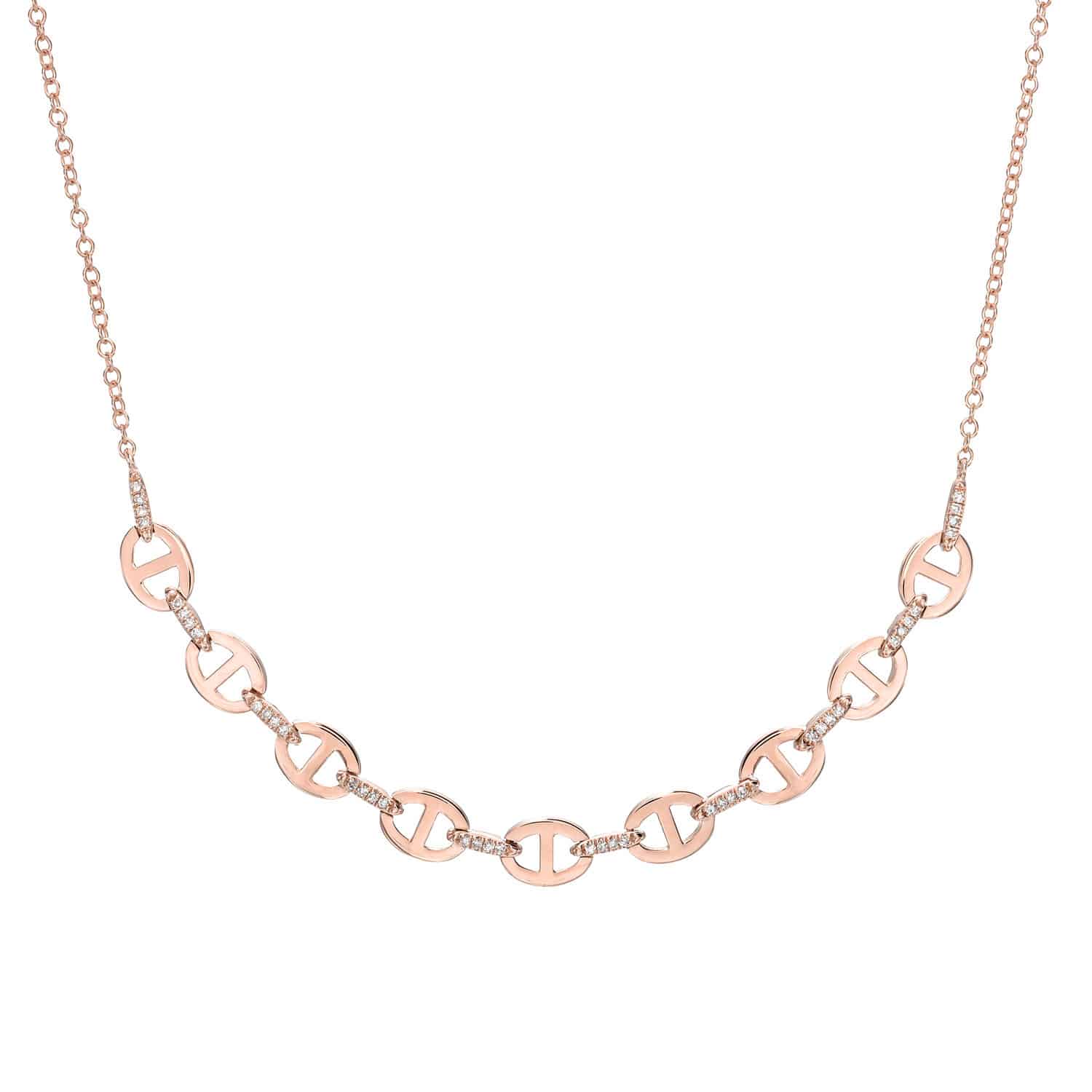 The Diamond Kaia Necklace from Janet Heller Fine Jewelry features interlocking circular links in rose gold, each adorned with cutout designs and sparkling embedded diamonds, all elegantly connected by a delicate chain. For custom jewelry or additional inquiries, please contact us.
