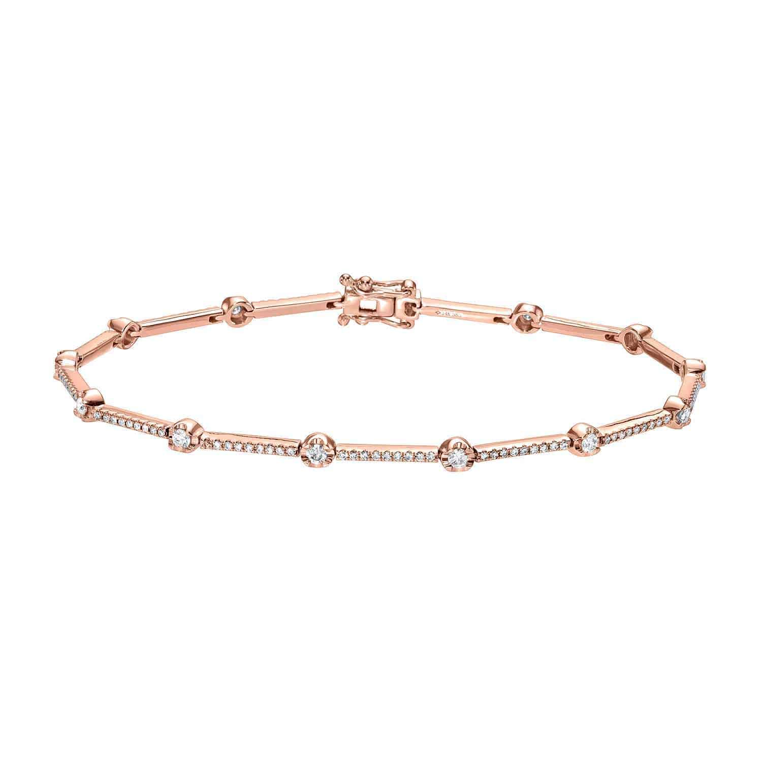 The Segmented Diamond Bracelet by Janet Heller Fine Jewelry showcases a refined rose gold band adorned with evenly spaced sparkling diamonds and finished with a secure clasp—a stunning testament to the brand’s exceptional craftsmanship in fine jewelry.