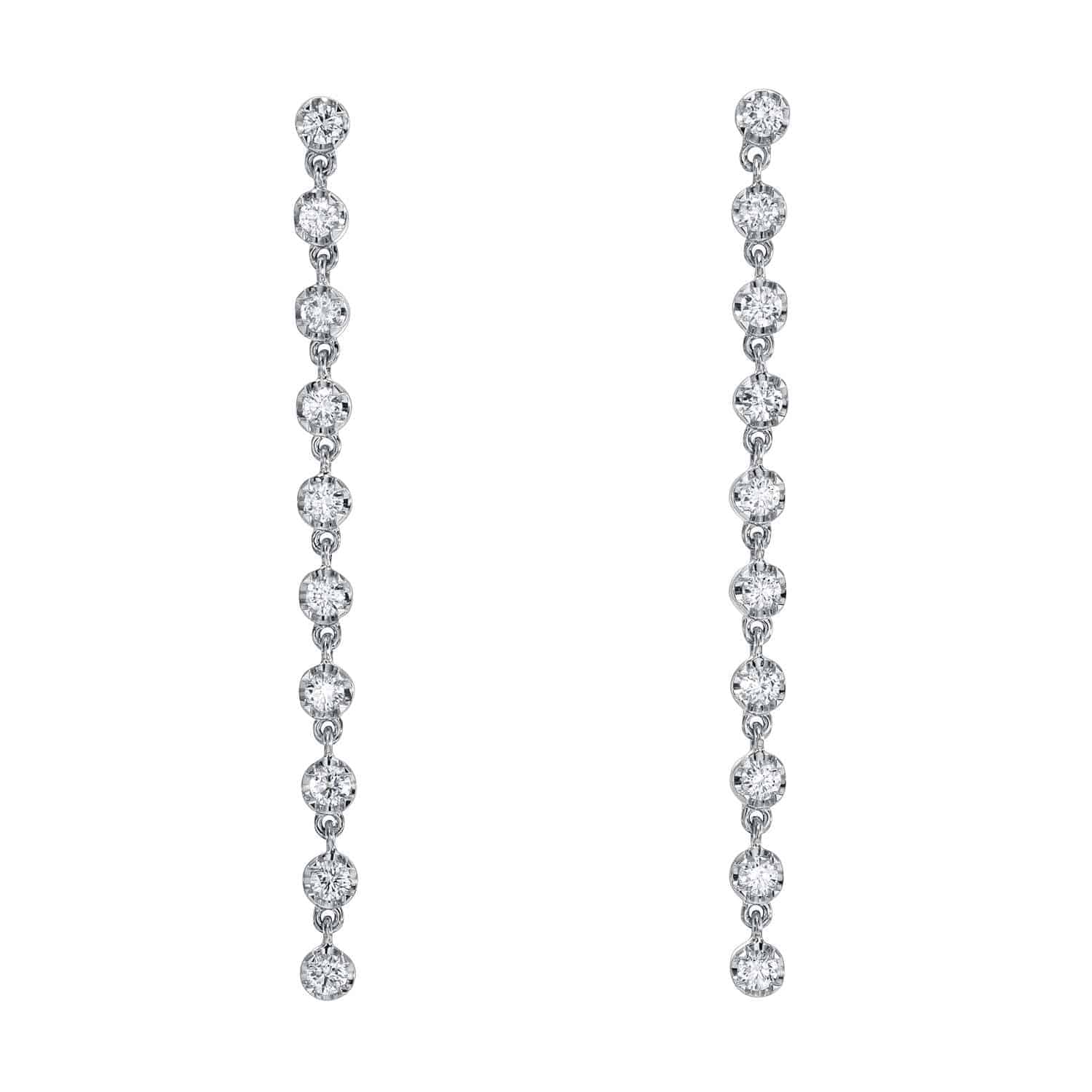 A pair of long, dangling earrings from Janet Heller Fine Jewelry, the 10 Drop Diamond Reagan Earrings feature a sleek vertical line of round, sparkling diamonds set in an elegant and minimalist design against a white background—an exquisite example of fine jewelry craftsmanship.