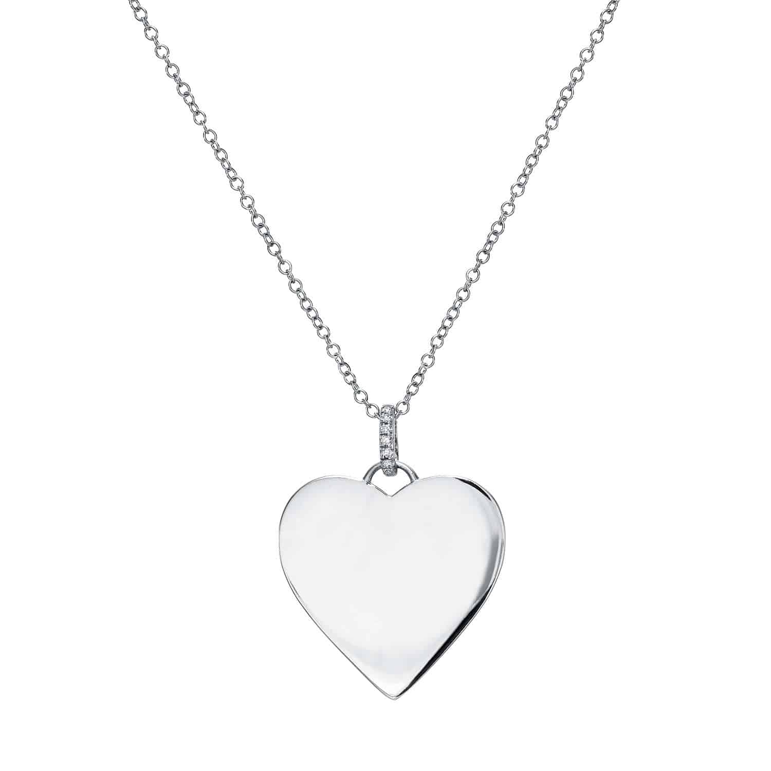 The Brinley Necklace showcases a thin silver chain adorned with a sleek, polished heart-shaped pendant. The plain heart design, free of engravings or embellishments, makes this necklace an excellent choice for those seeking an elegant and customizable piece that rests gracefully at the center of the delicate chain.