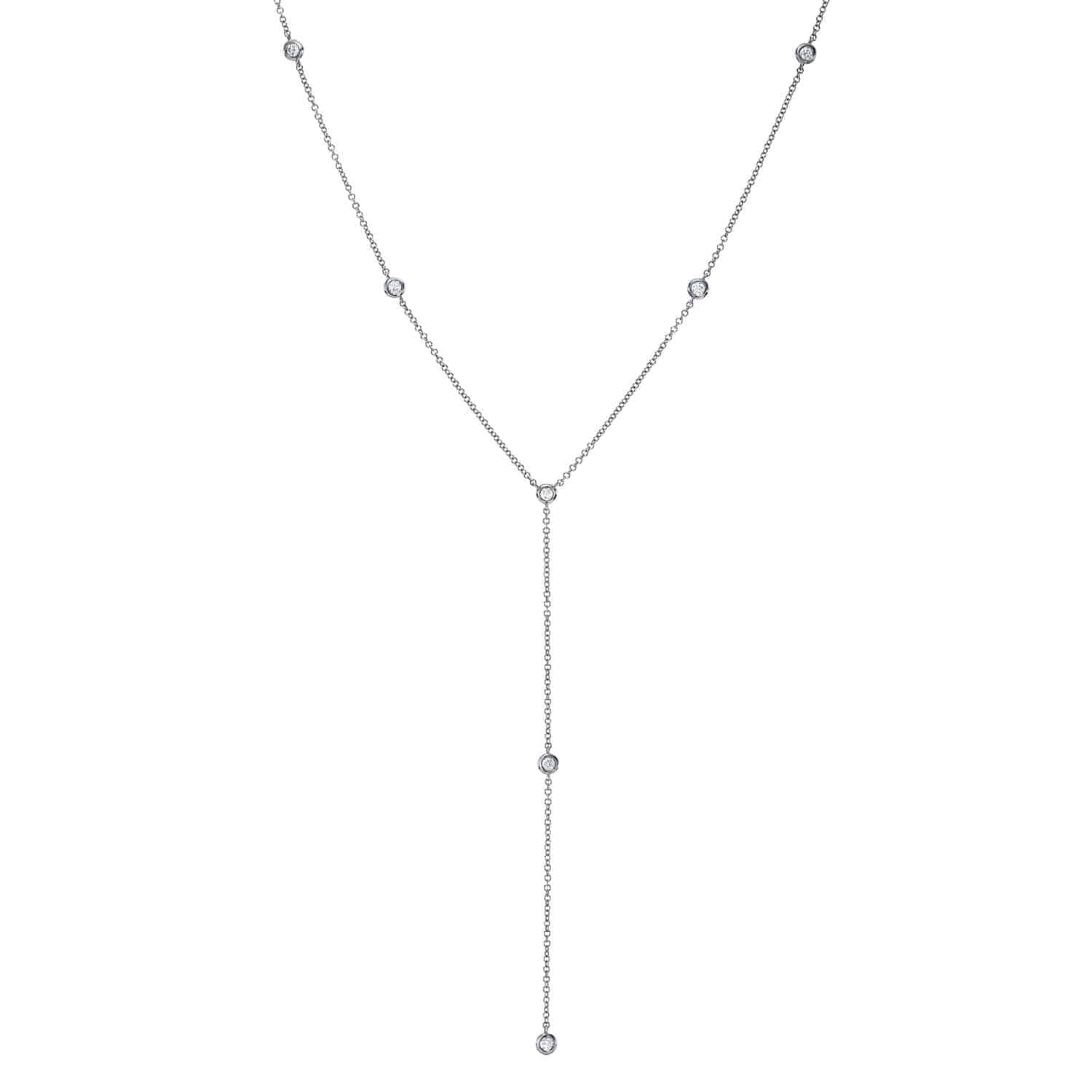 Introducing the Diamond Logan Lariat—a delicate silver lariat necklace adorned with small round diamonds evenly spaced along the chain and finished with a sparkling drop pendant. This exquisite piece beautifully embodies Janet Heller Fine Jewelry’s dedication to fine jewelry craftsmanship.