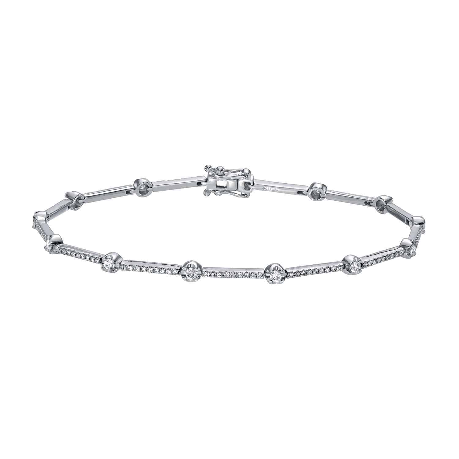 The Segmented Diamond Bracelet by Janet Heller Fine Jewelry features a delicate silver band adorned with small round diamonds and is secured with a clasp closure. This elegant piece can be customized to suit your preferences—please contact us for custom jewelry options or inquiries.