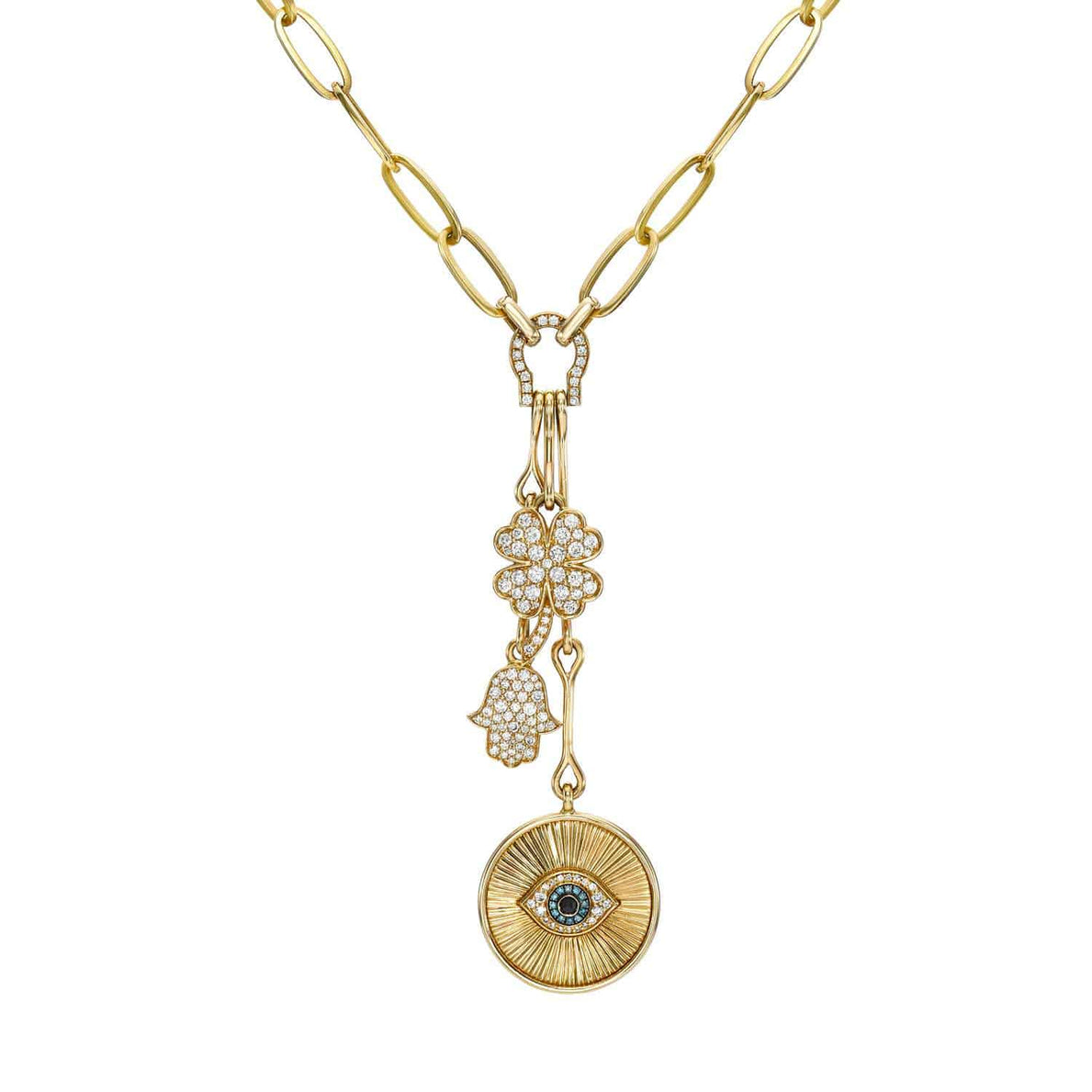Explore the Evil Eye Medallion Necklace from Janet Heller Fine Jewelry. This refined gold chain showcases three unique charms: an eye pendant, a pave diamond hand, and a flower. Its exquisite design offers rich texture and shape. Contact us for customizations to personalize your piece.