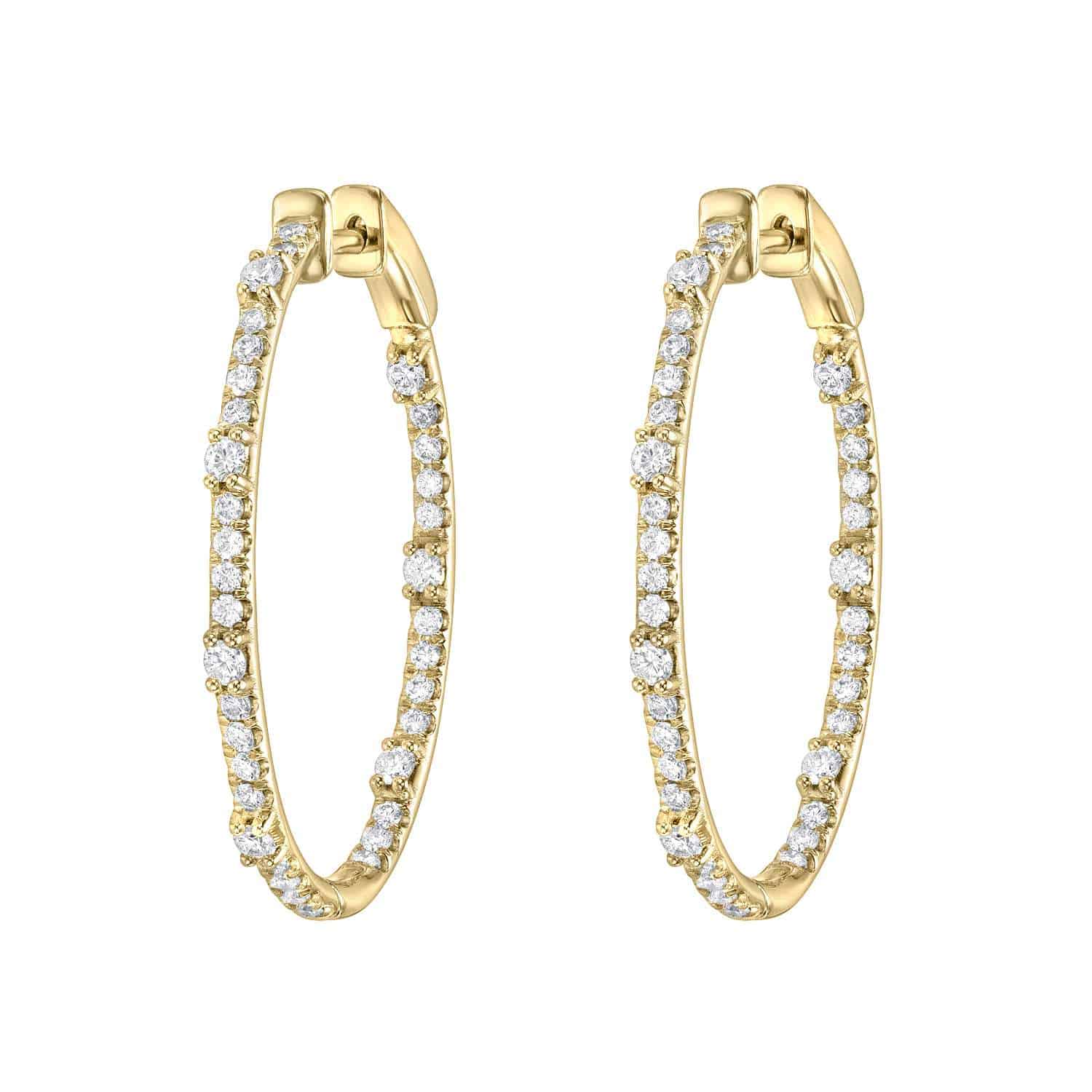 Oval Chandler Hoops—elegant gold hoop earrings adorned with small, round white diamonds—are displayed side by side on a white background. This sophisticated pair is from Janet Heller Fine Jewelry. For jewelry inquiries or to discuss custom jewelry options, please contact us. Product Name: Oval Chandler Hoops | $6,300.00.