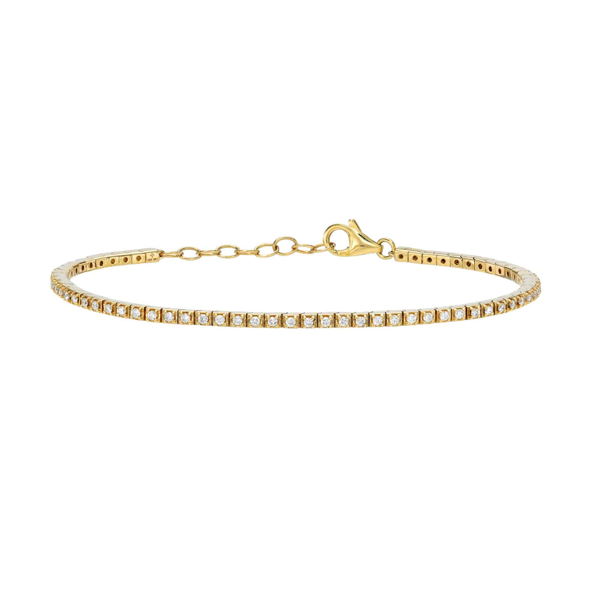 The Diamond Augustus Tennis Bracelet is a thin gold piece featuring small, evenly spaced clear stones and an adjustable clasp, shown against a white background.