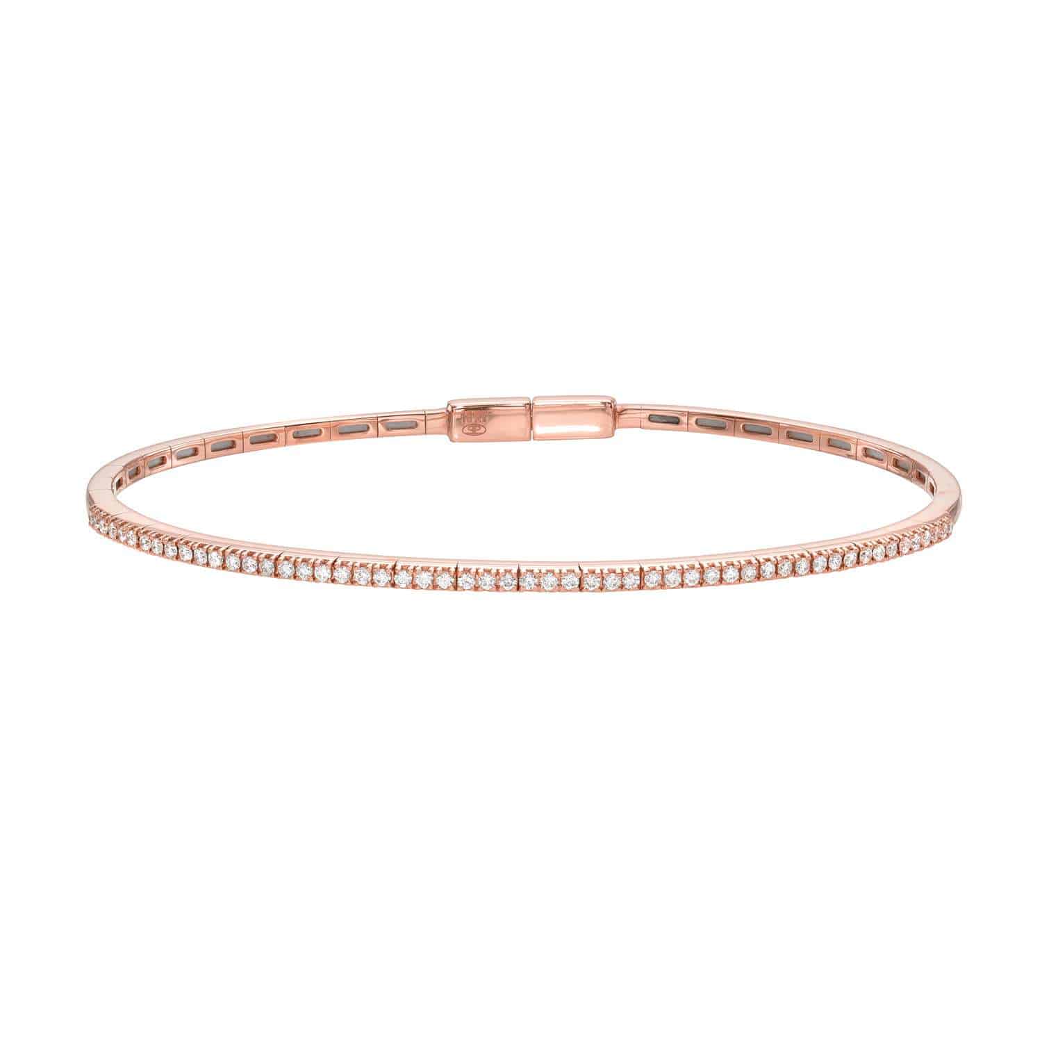 The Diamond London Bangle by Janet Heller Fine Jewelry is a delicate rose gold bracelet adorned with a row of sparkling diamonds and finished with a simple clasp, embodying the timeless beauty and exceptional craftsmanship of custom fine jewelry.