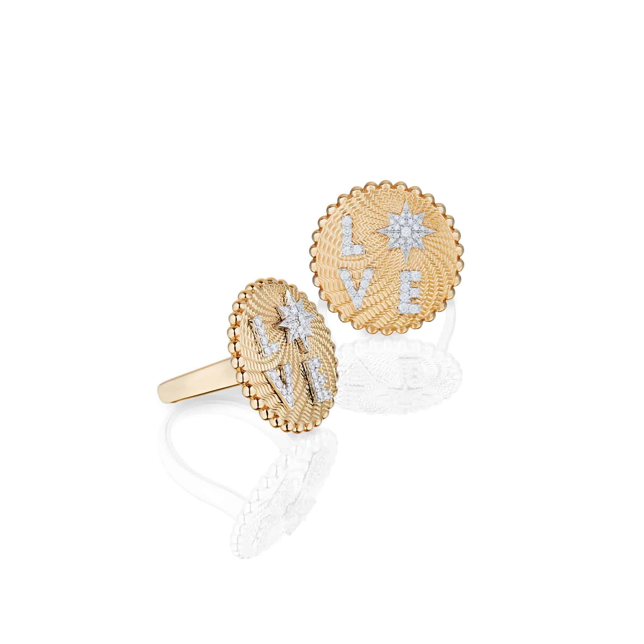 Love Frequency Ring: A gold ring with a round, textured face featuring the word “LOVE” in raised silver letters and a star design, shown from two angles on a white background.