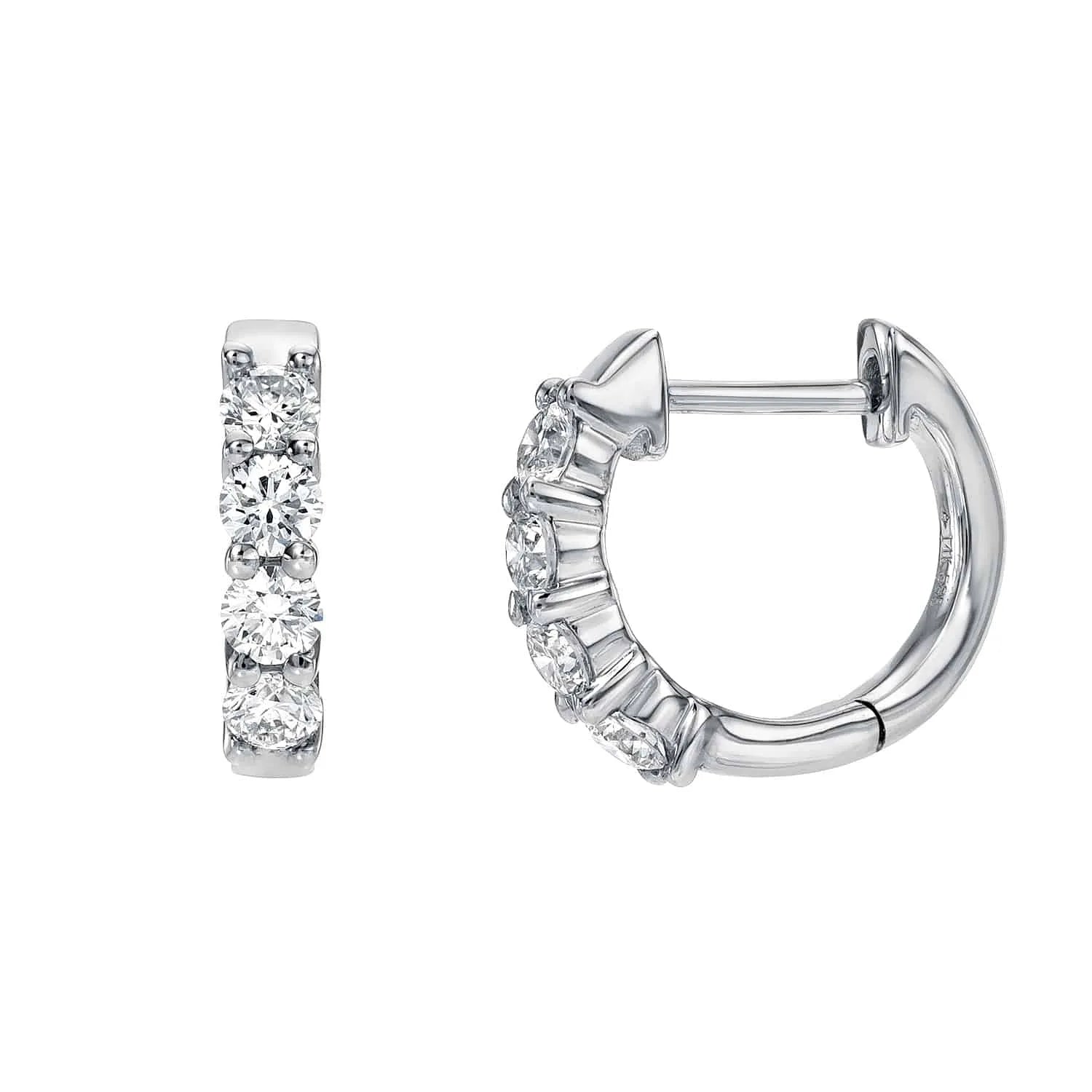 A pair of Diamond Dixie Huggies in silver, each featuring three round, clear gemstones set along the front—shown from both front and side views against a white background—these earrings exemplify Janet Heller Fine Jewelry’s custom craftsmanship.